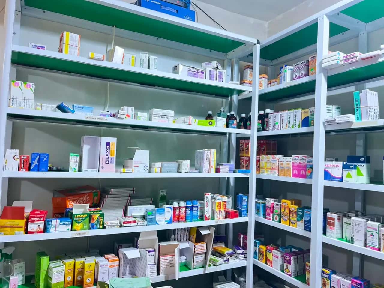 Shelves inside Marisca Pharmacy, including the anti-hypertension section and pain gels.